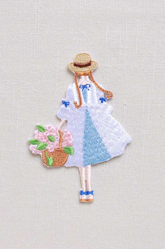 The Blossom-holding girl